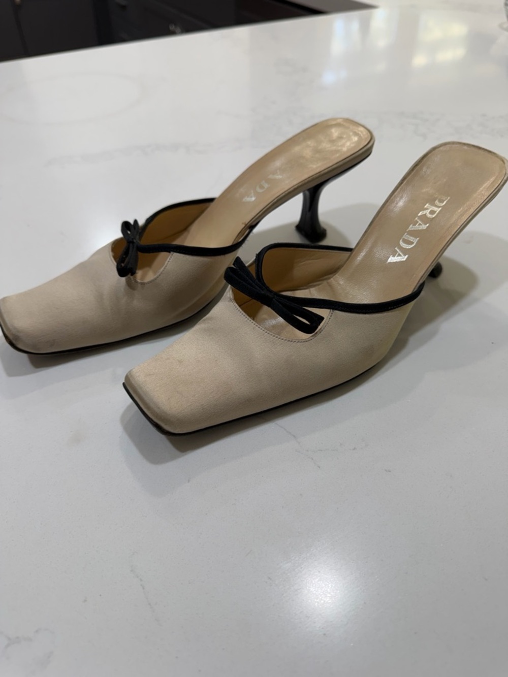 Prada Cream Leather Square-Toe Mules with Black Bow